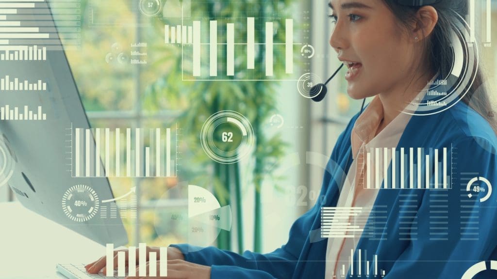 Woman on computer with graphs showing in the ether around her