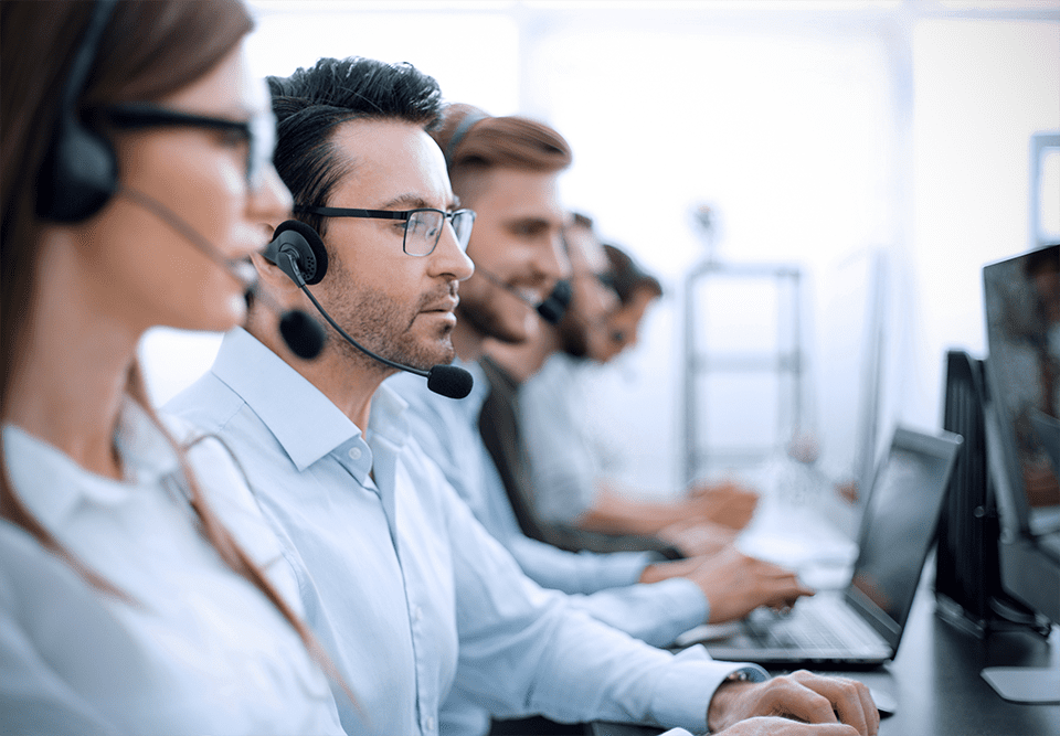 Contact center agents working with headsets and computers
